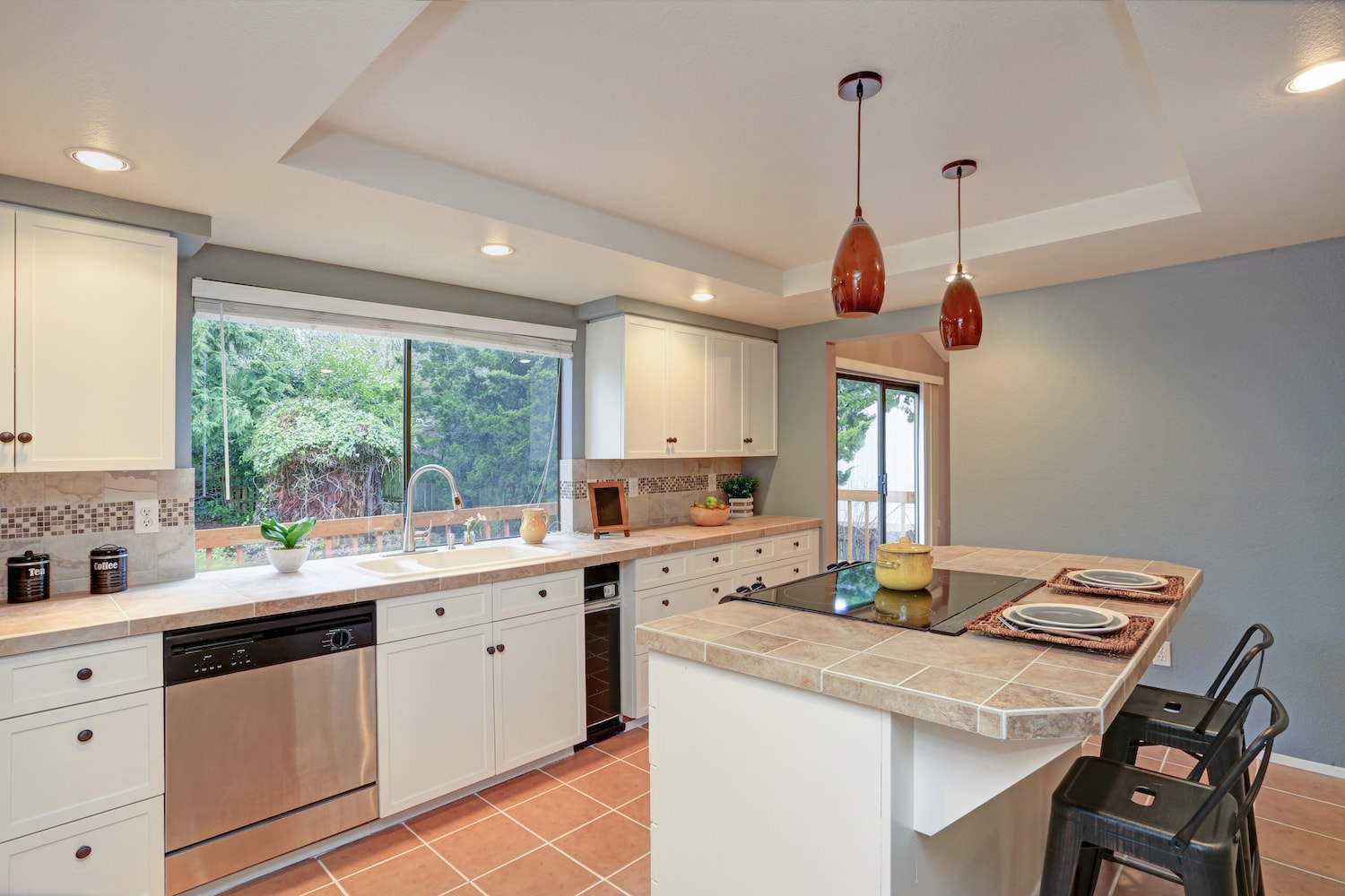 tray ceiling well lit kitchen